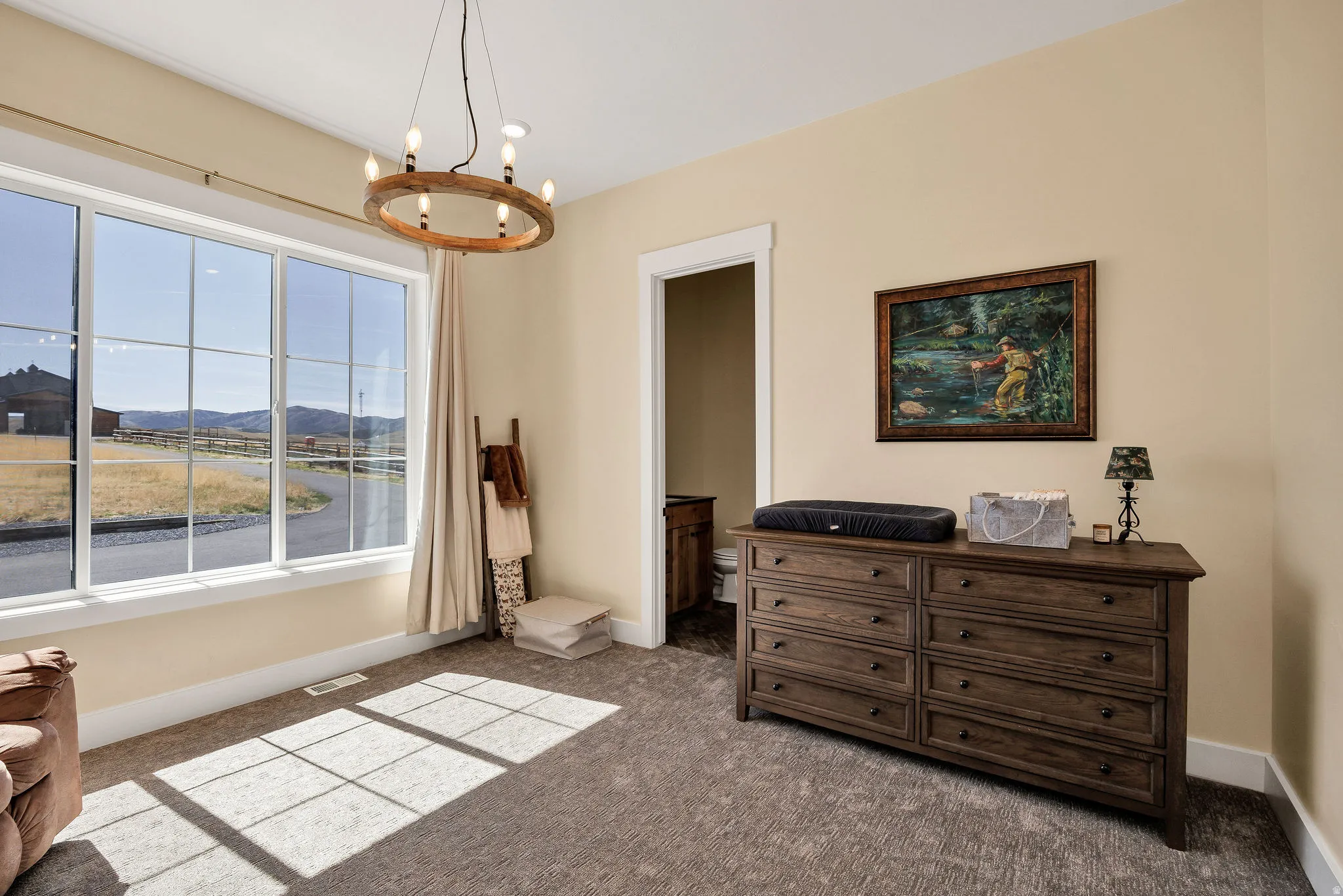 Recessed lighting, wood-finish chandelier, multiple pane windows, neutral wall tones, and textured carpet flooring