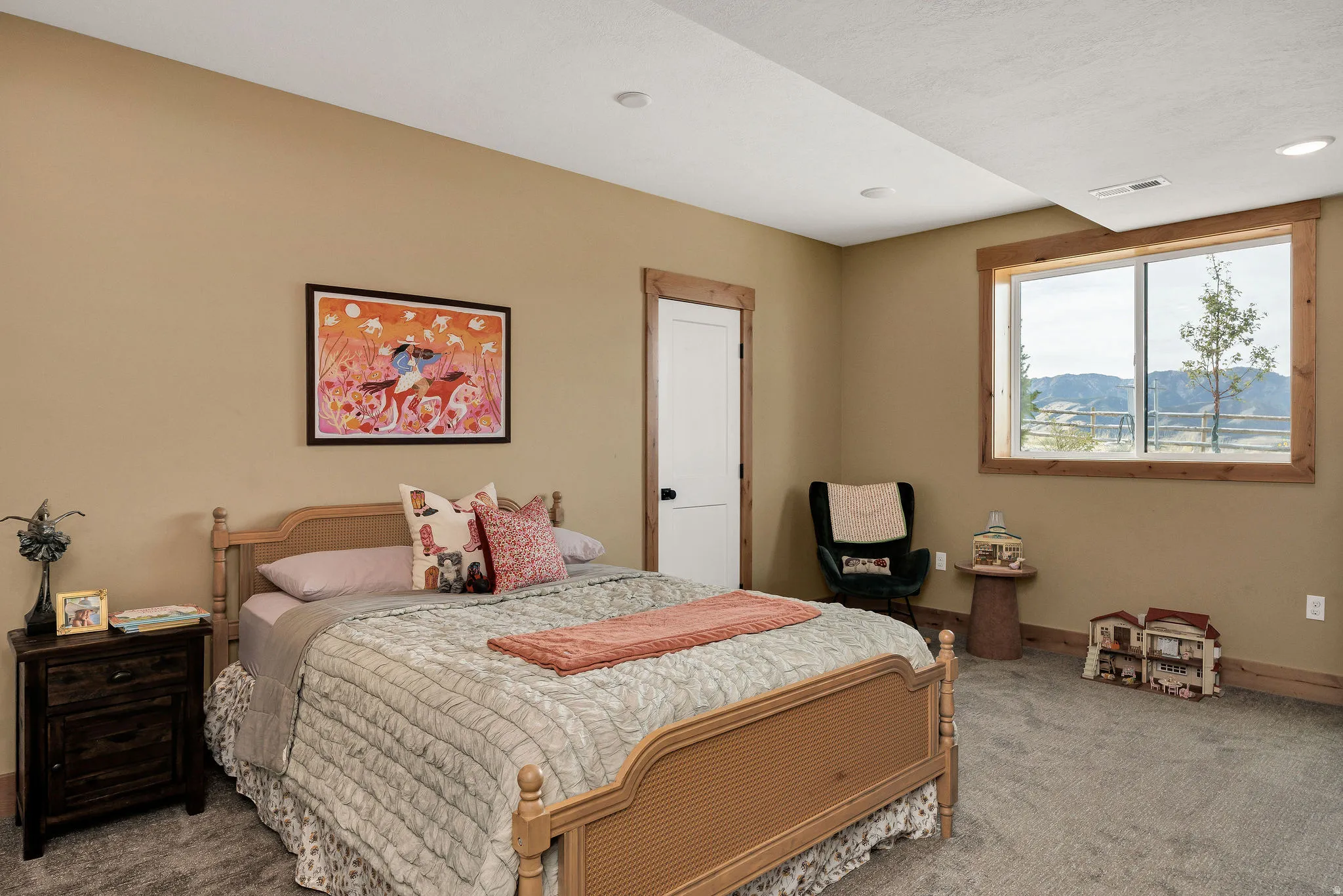 Recessed lighting, wood-finish window trim, and wall-to-wall carpeting