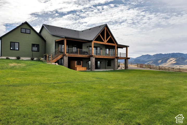 Modern farmhouse exterior with green siding and black trim