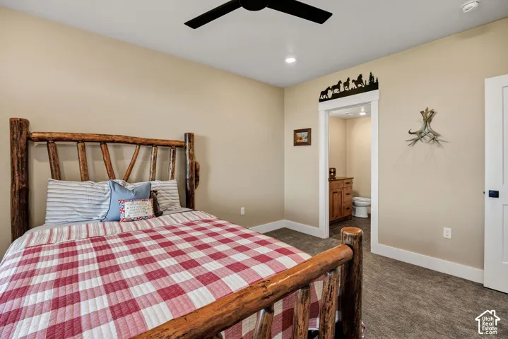 Neutral wall paint, recessed lighting, ceiling fan, carpet flooring, and a white interior door
