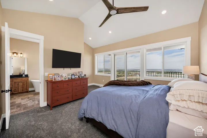 Vaulted ceiling with recessed lighting and ceiling fan
