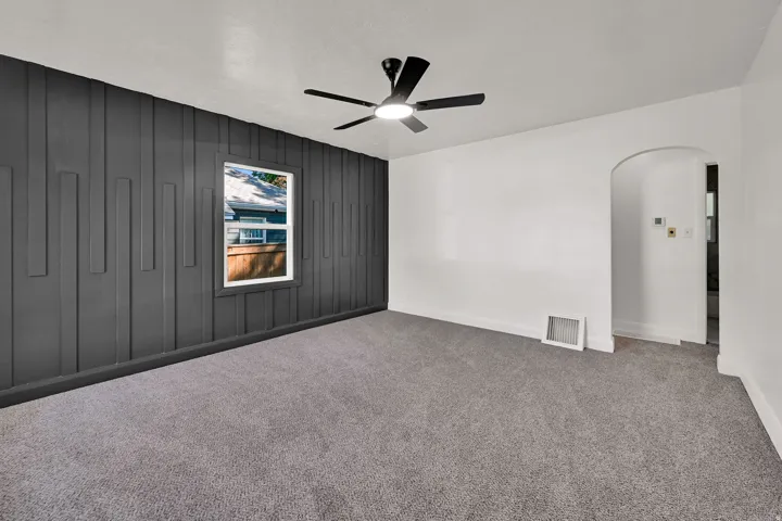 Accent wall featuring decorative vertical paneling