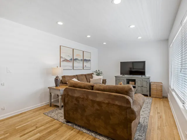 Natural light living room with hardwood floors.