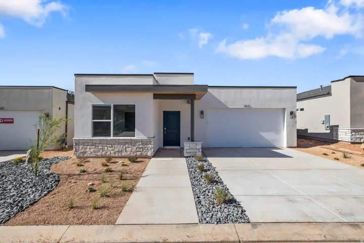 Contemporary exterior with stucco siding and a stone facade
