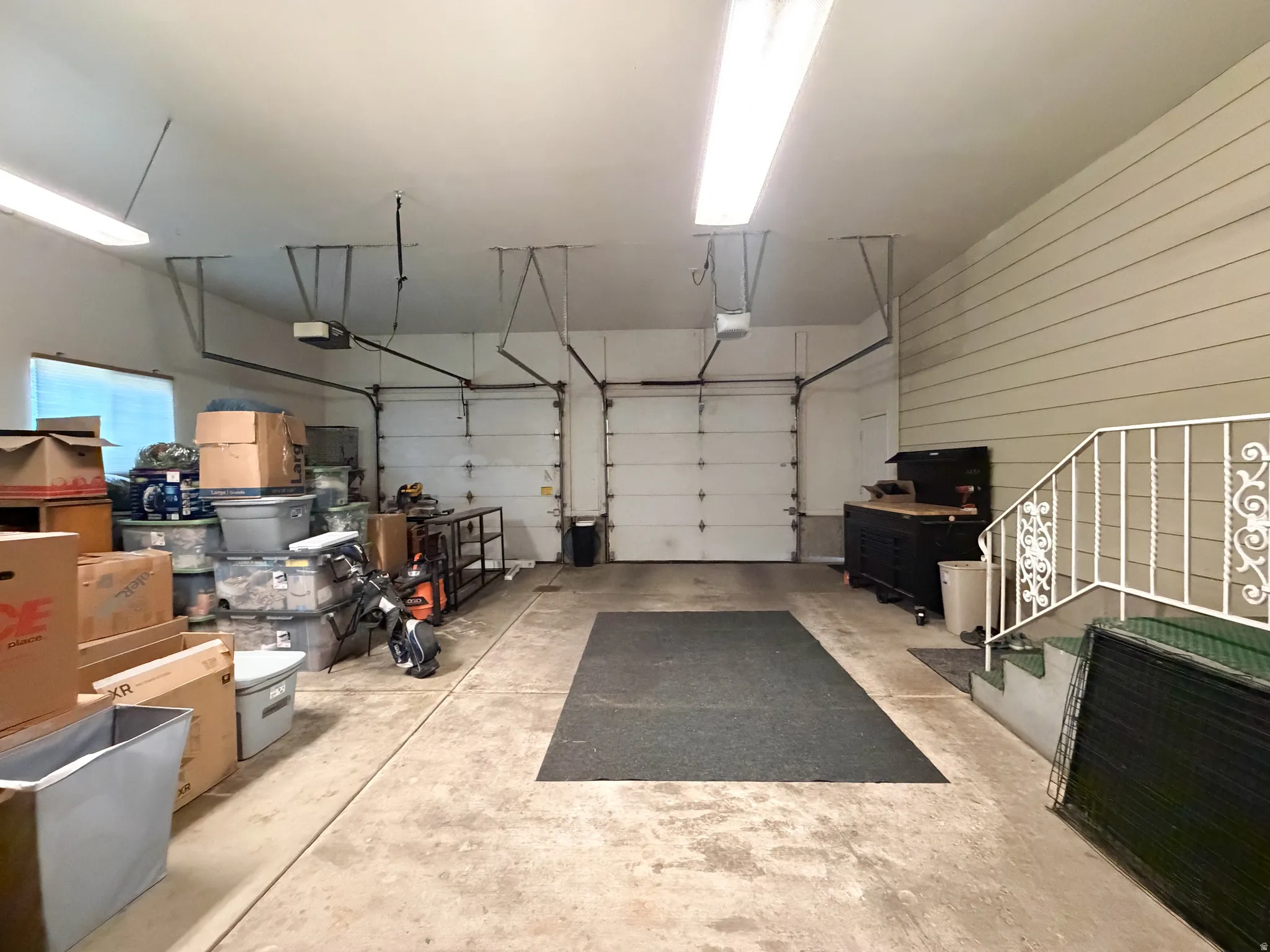 2 car garage with 3 separate man doors