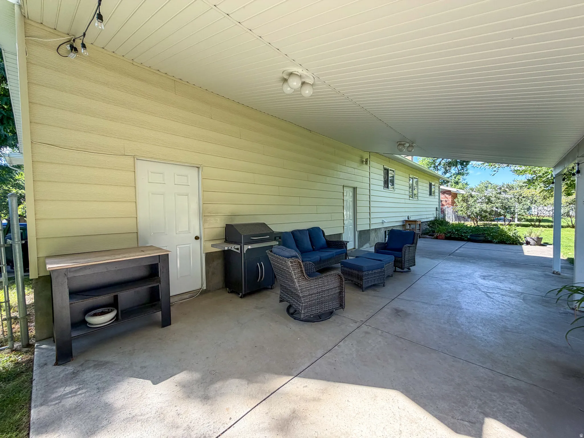 peaceful backyard patio with awning