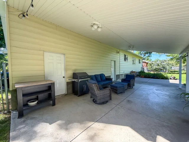 peaceful backyard patio with awning