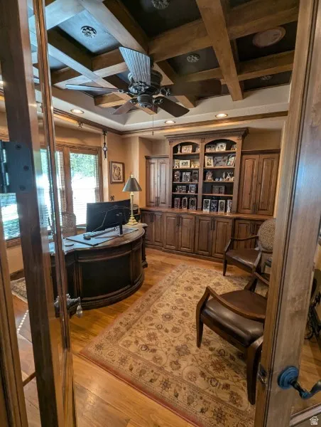 Coffered wood-beam ceiling with a ceiling fan