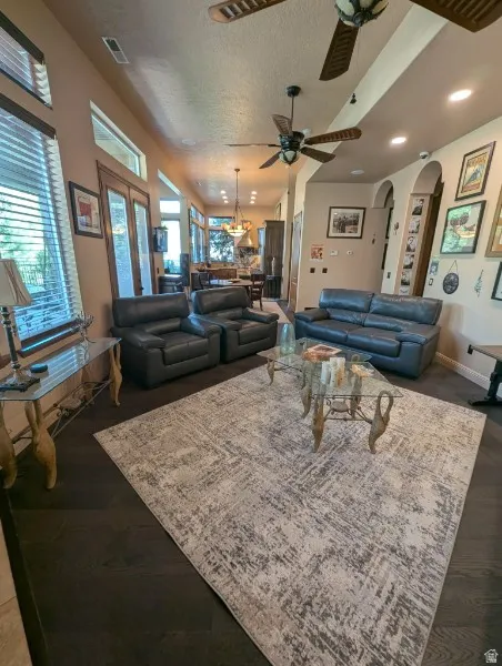 Dark wood-finish flooring with recessed lighting
