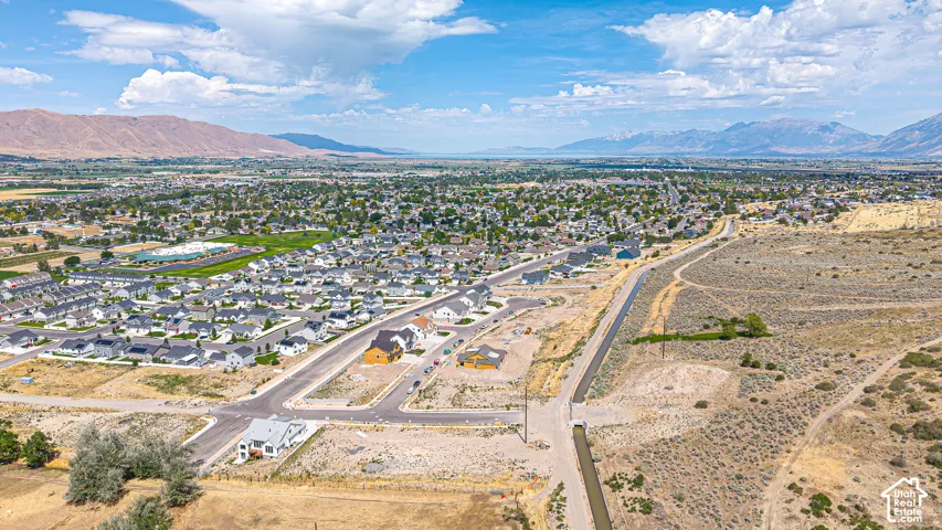 Residential development featuring a mix of completed homes and new construction sites