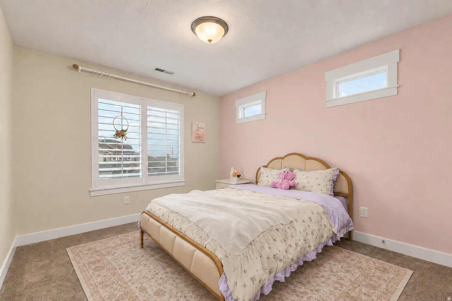 Recessed ceiling light, white window shutters, double window, two upper transom windows, and wall-to-wall carpeting
