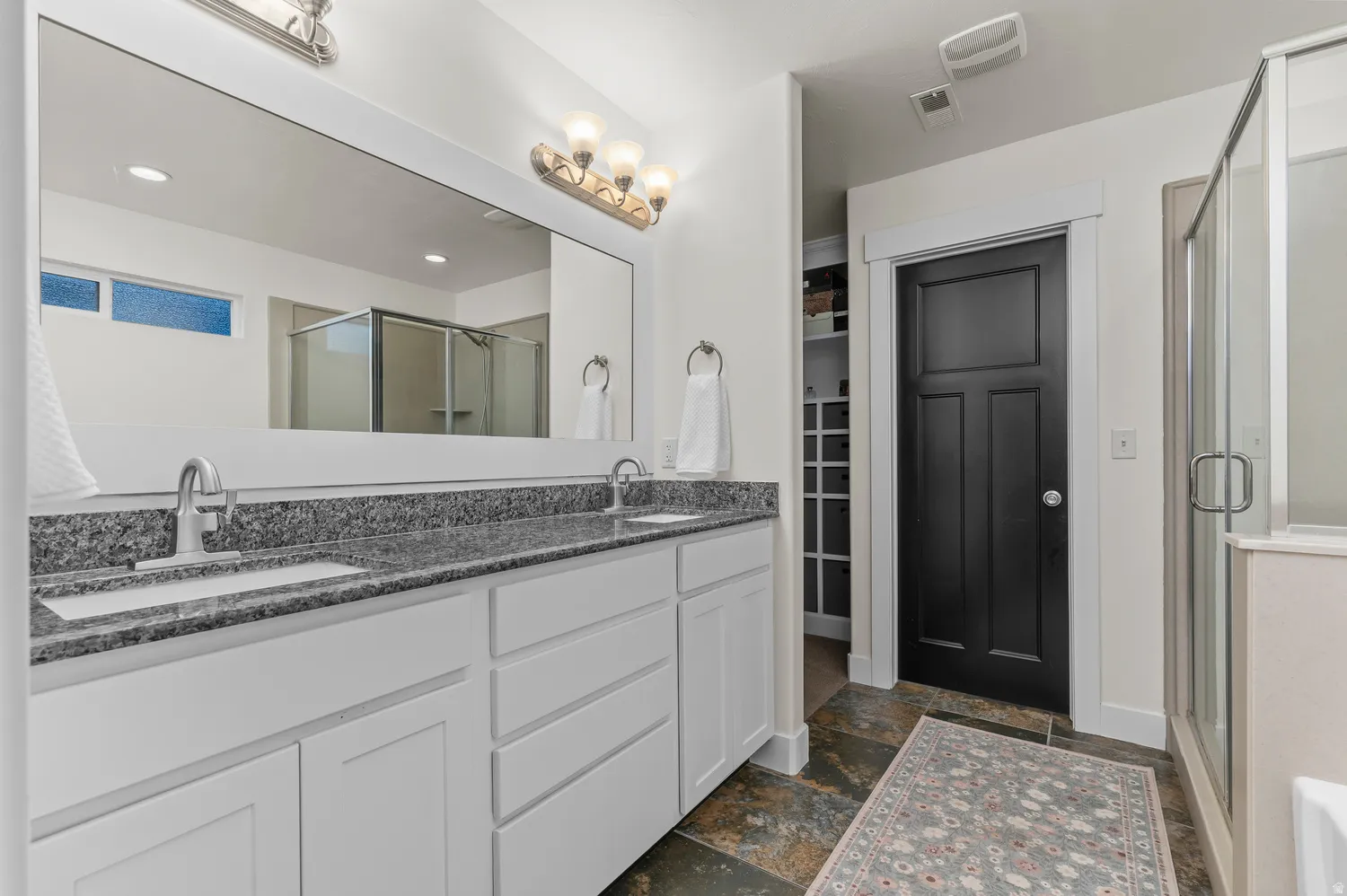 Double vanity with granite countertops and undermount sinks