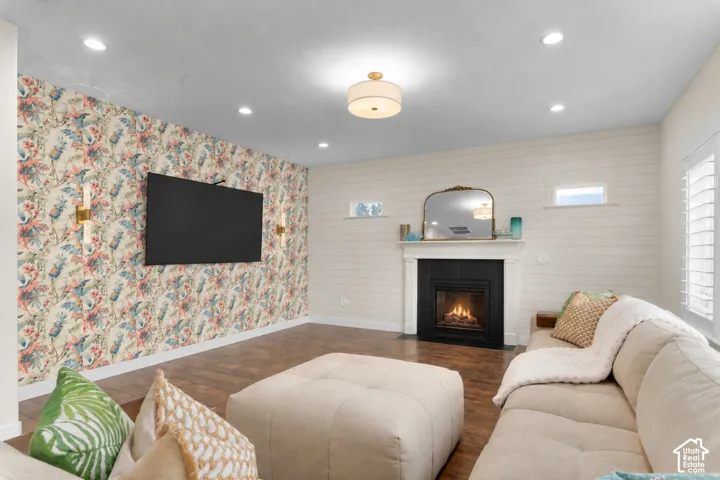 Accent wall with floral wallpaper and sconce lighting