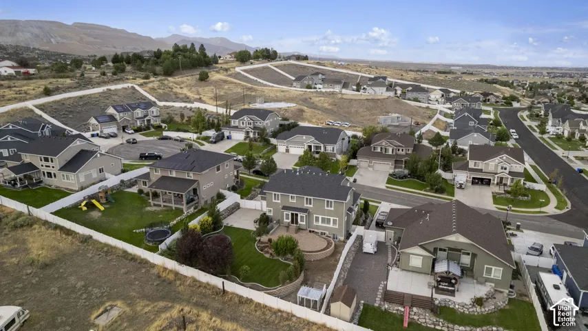 Residential neighborhood featuring varied architectural styles and mountain scenery