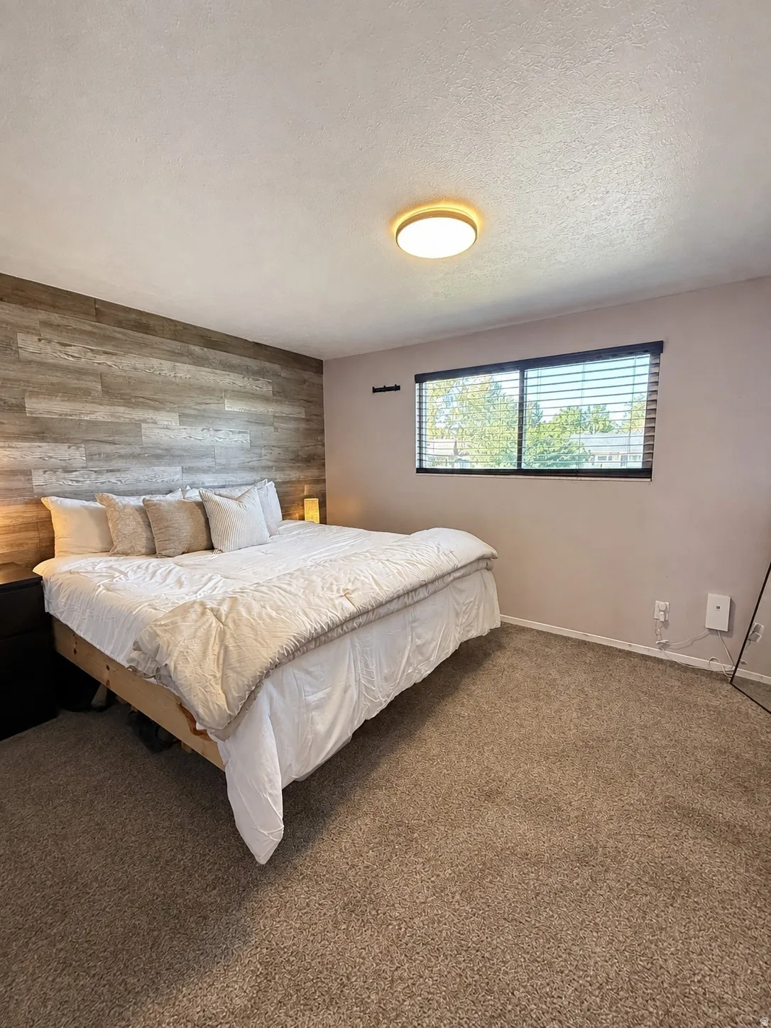 Primary Bedroom with accent wall