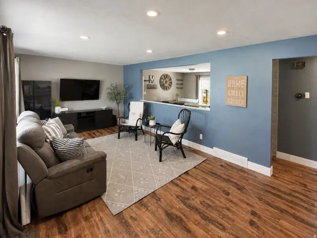 Large living room with cutout to kitchen, making it feel even more spacious.