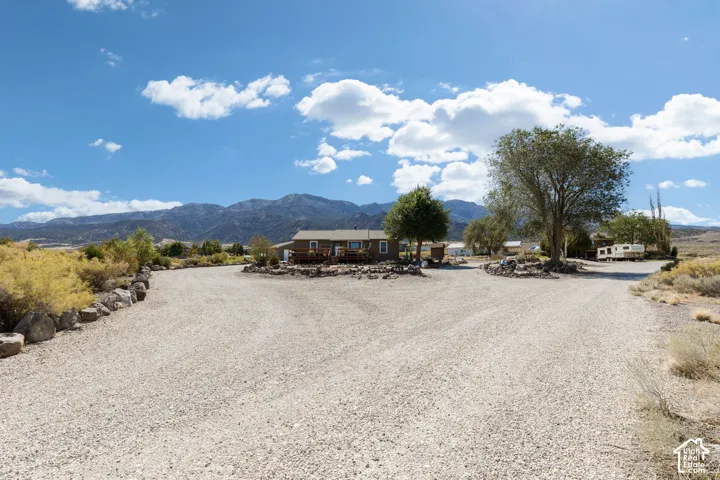Expansive gravel driveway providing ample parking