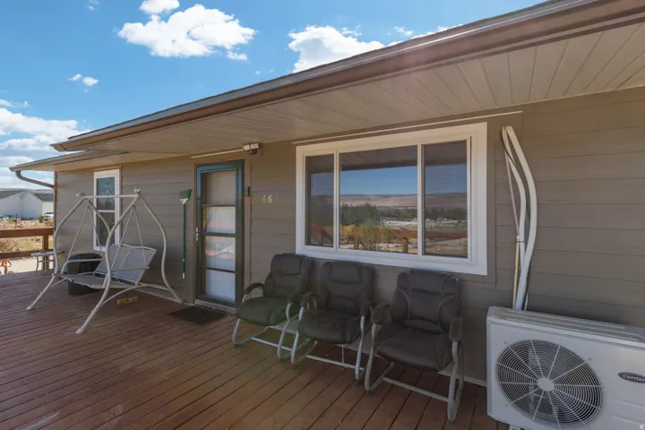Wood-finish deck with a covered porch entry