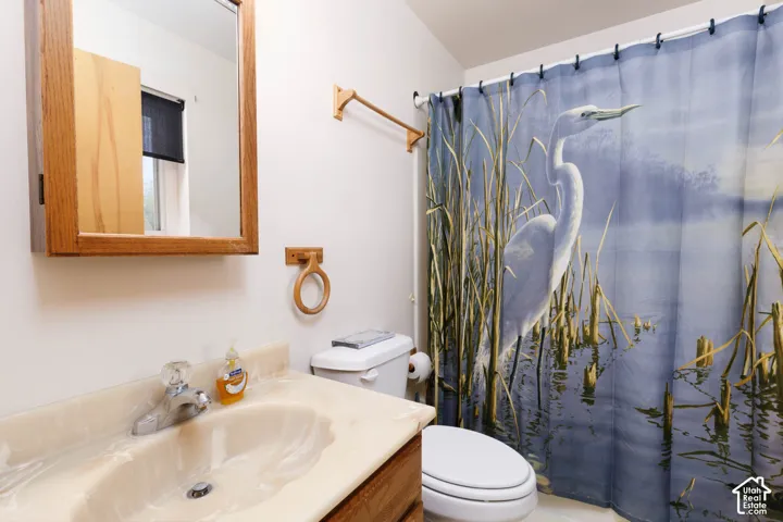 Wood-finish vanity with an integrated basin and countertop