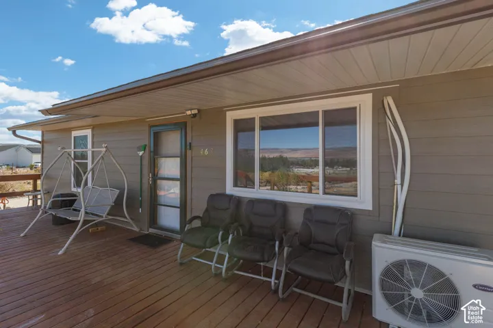 Wood-finish deck with a covered porch entry