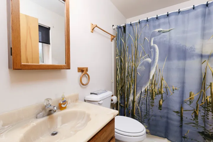Wood-finish vanity with an integrated basin and countertop