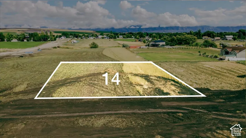 Expansive lot featuring varied terrain and distant mountain scenery