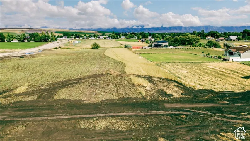 Expansive land parcel featuring a mix of cultivated and undeveloped terrain