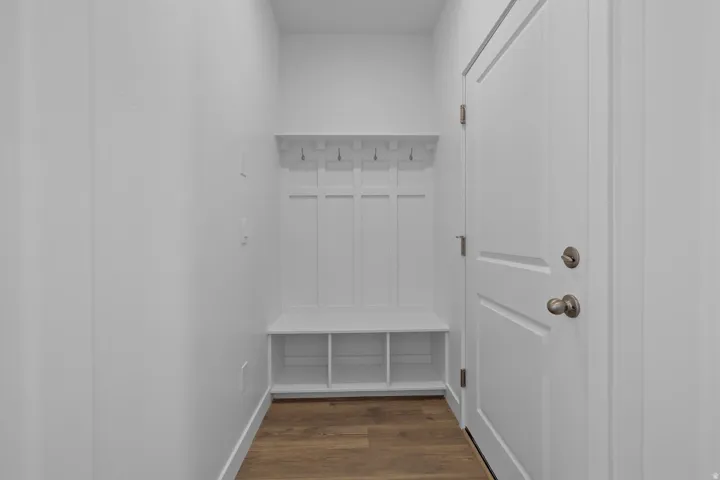 Built-in mudroom bench with storage cubbies and coat hooks