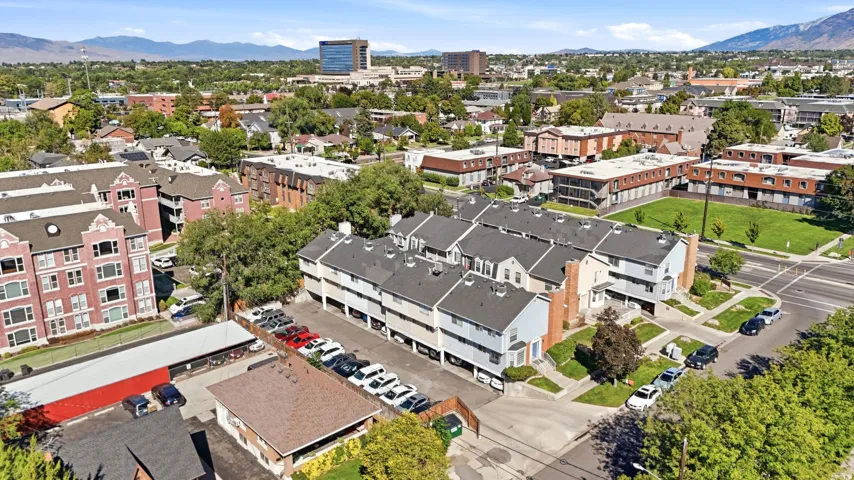 Townhome community featuring multi-level units, covered parking, and private entries