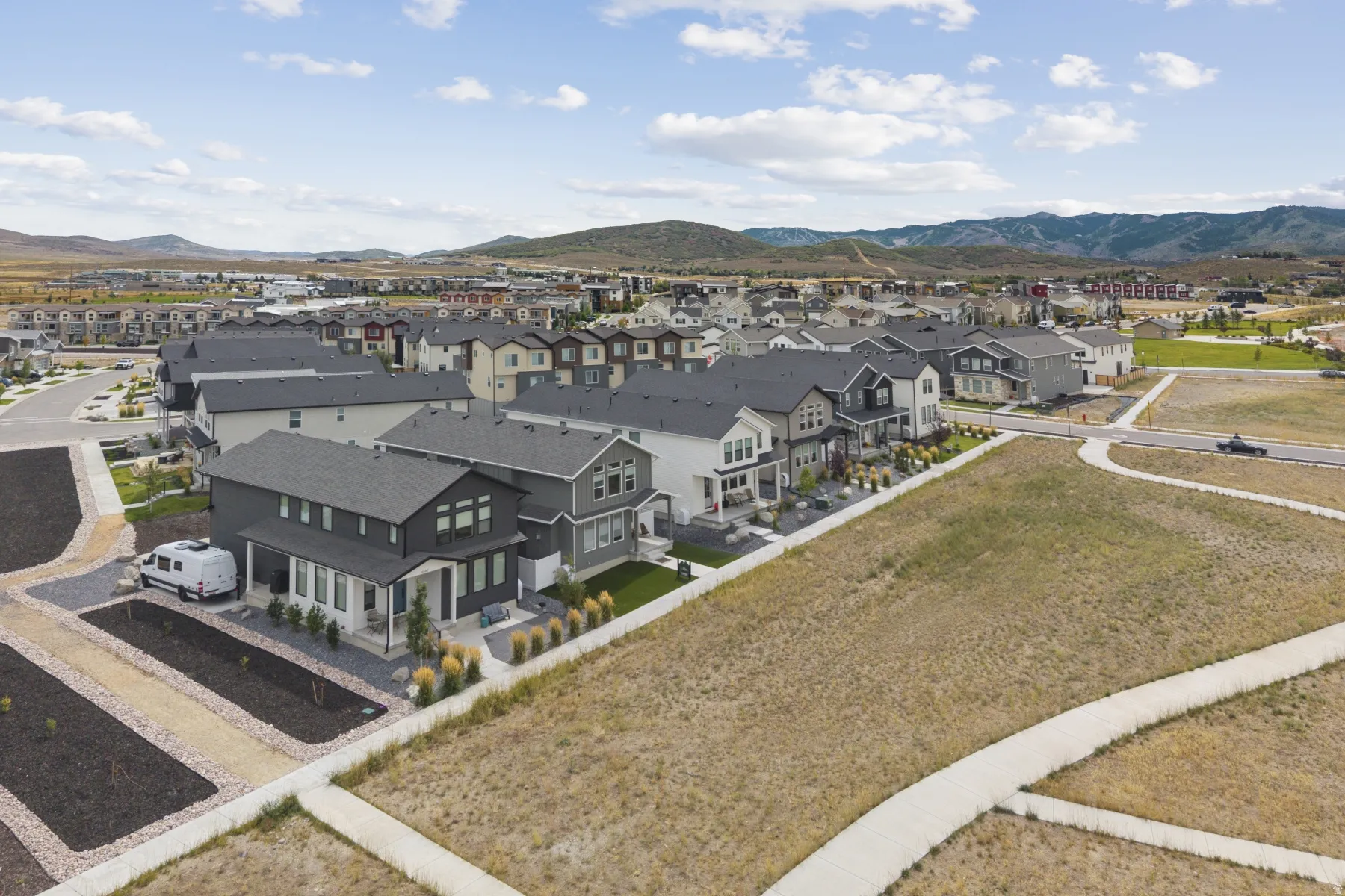 Expansive aerial perspective showcasing a residential neighborhood with varied architectural styles