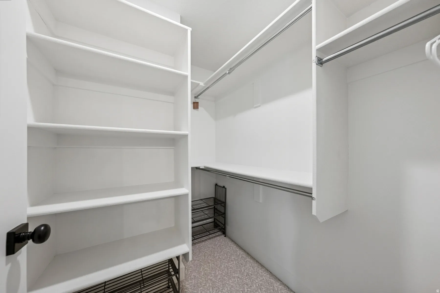 Built-in shelving, multiple hanging rods, and ample storage space