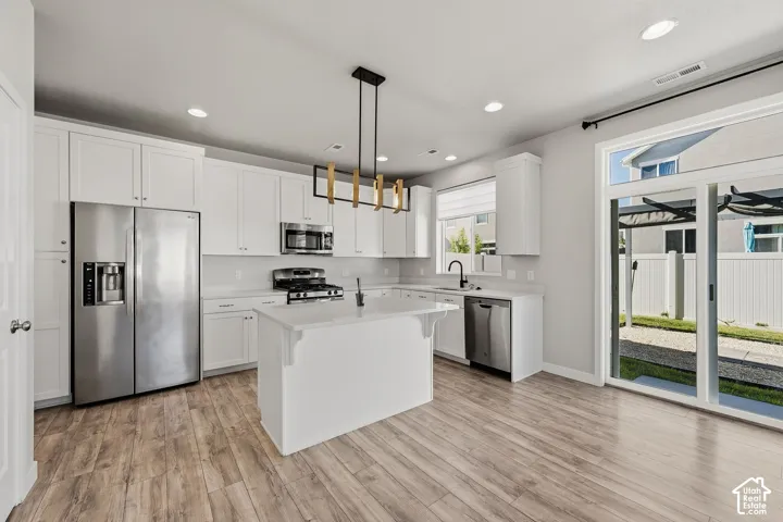 Kitchen - quartz counters, gas range, island