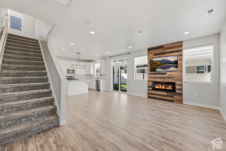 Entry way into great room with electric fireplace