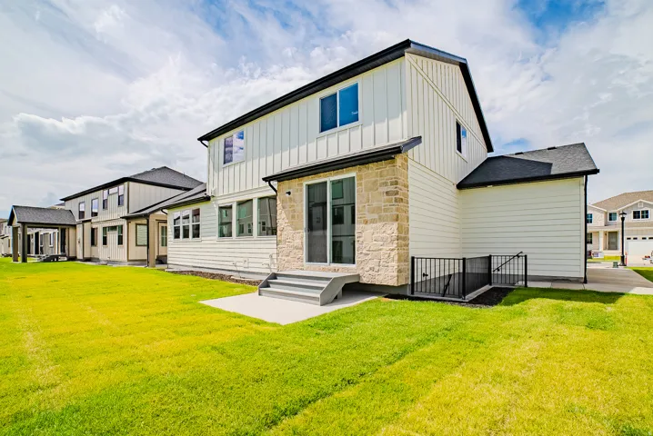Exterior architecture featuring vertical and horizontal siding with stone accents