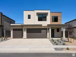 Modern exterior with a light stucco finish and wood-look paneling
