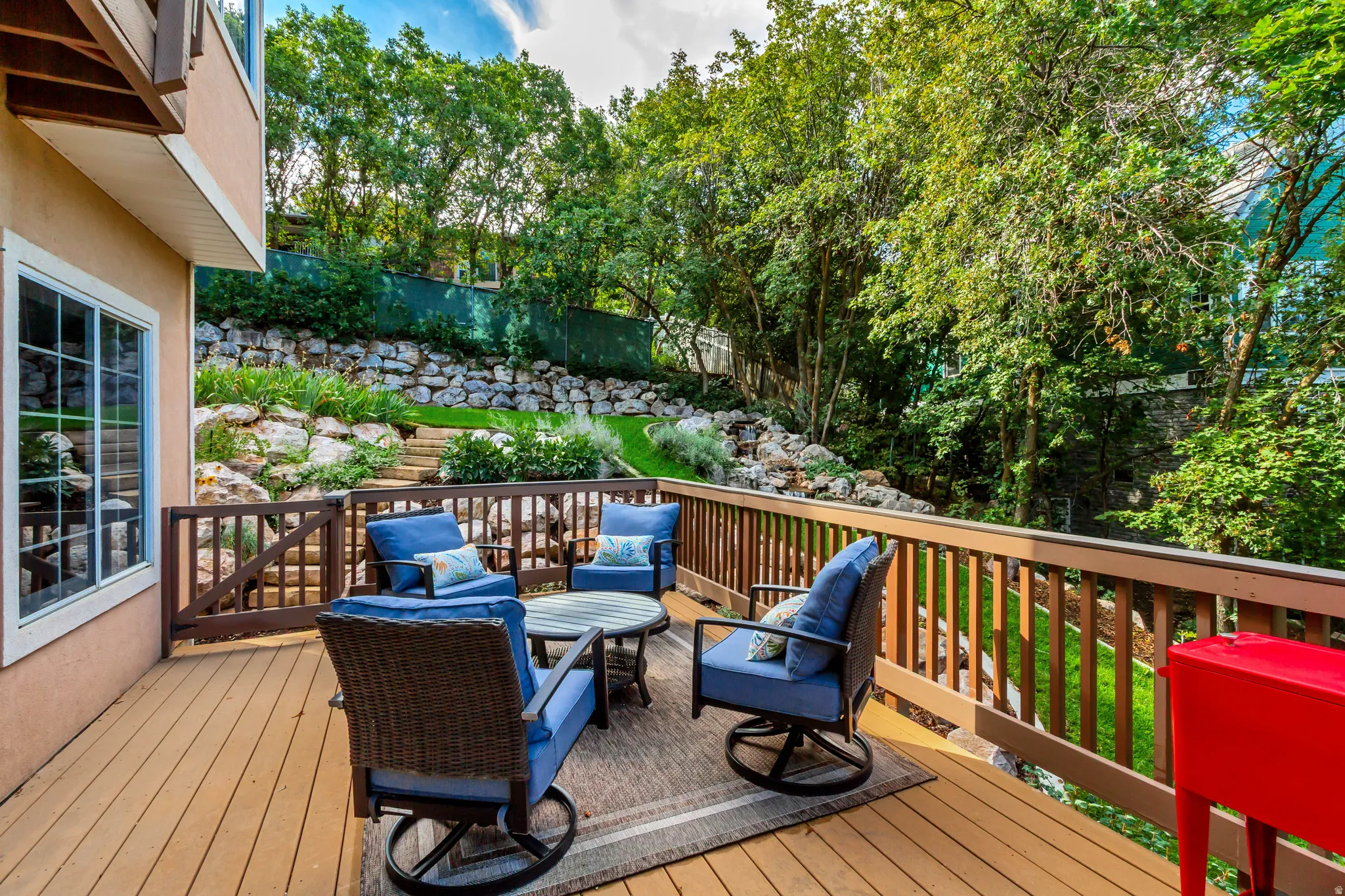 Spacious outdoor deck featuring wood-finish flooring and a perimeter railing