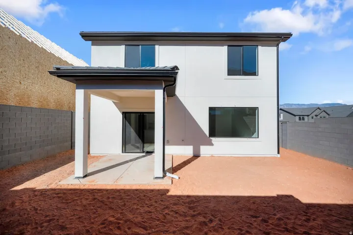 Contemporary stucco exterior with black-framed windows