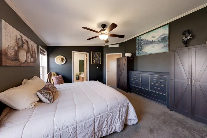 Recessed lighting, ceiling fan with light fixture, window with blinds, dark-toned walls, and crown molding