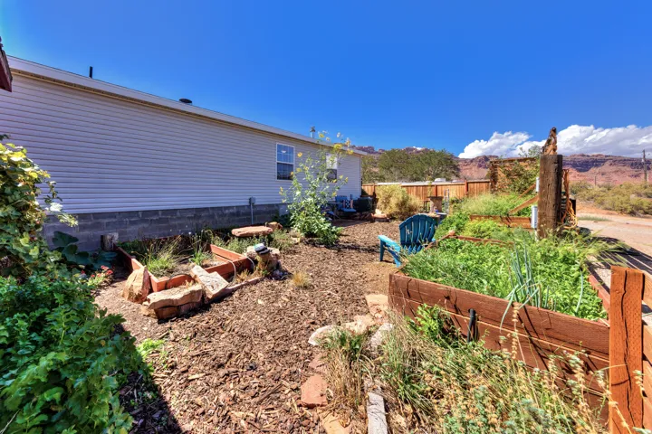 Property exterior with horizontal siding and a block foundation