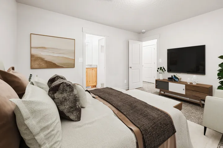 Recessed lighting, light-colored walls, and carpet flooring