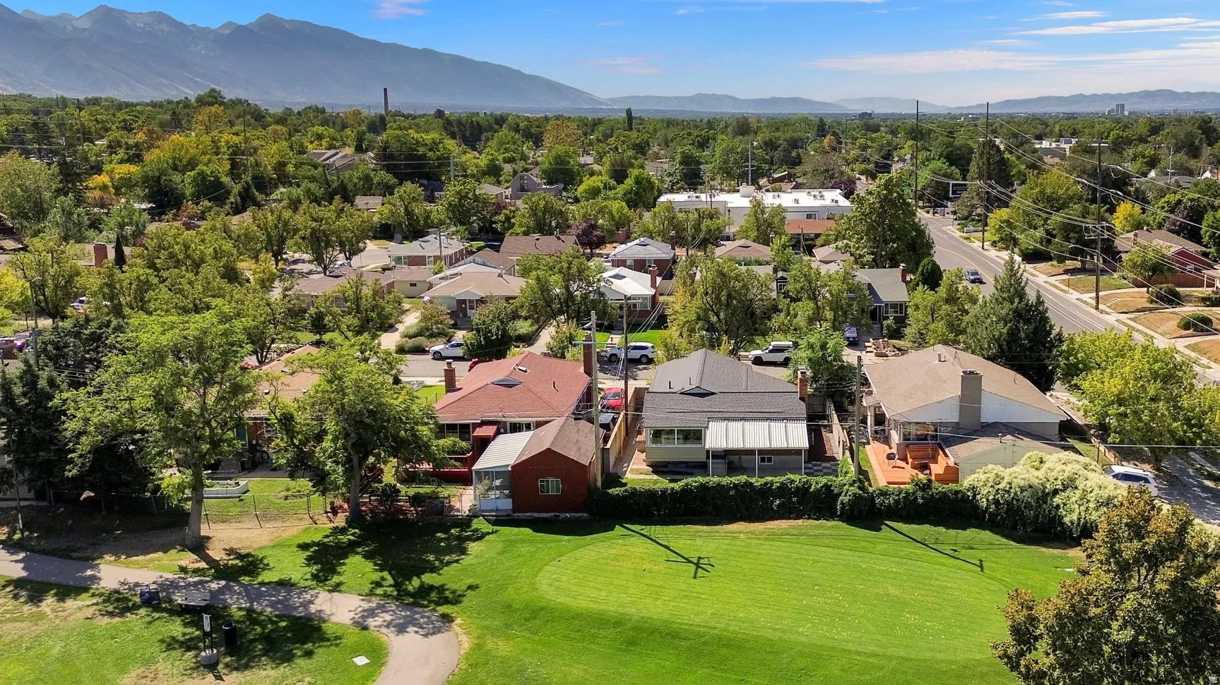 Expansive green space and mature trees bordering the property