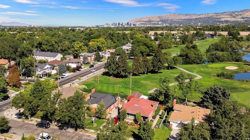 Expansive green spaces and established residential areas with mature trees