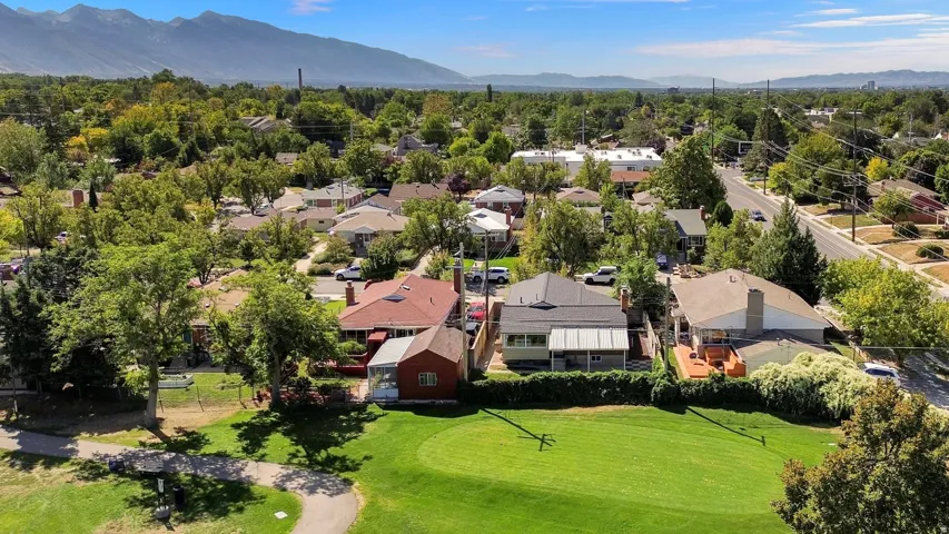Expansive green space and mature trees bordering the property