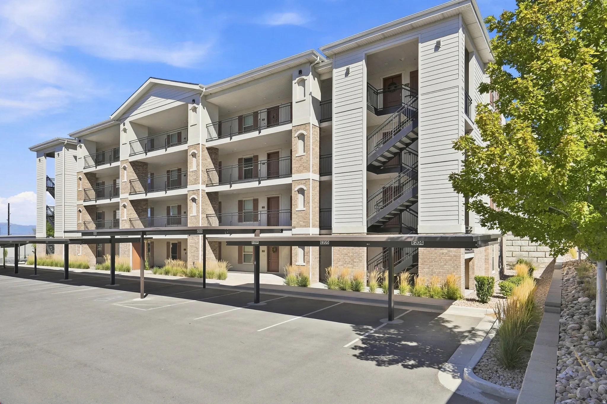 Multi-story building with siding and stone facade
