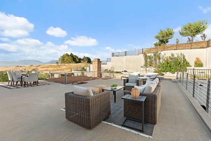 Expansive outdoor patio area with metal railings