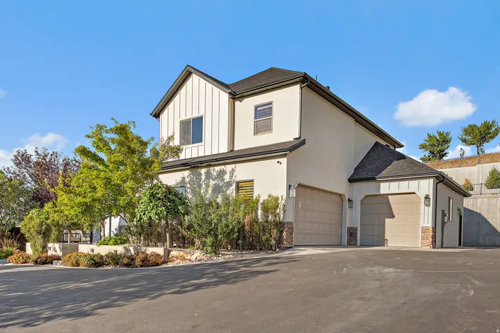 Modern exterior with vertical siding and stucco finishes