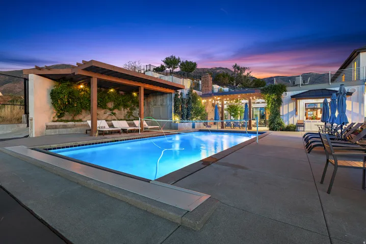 In-ground pool featuring a perimeter coping and concrete decking