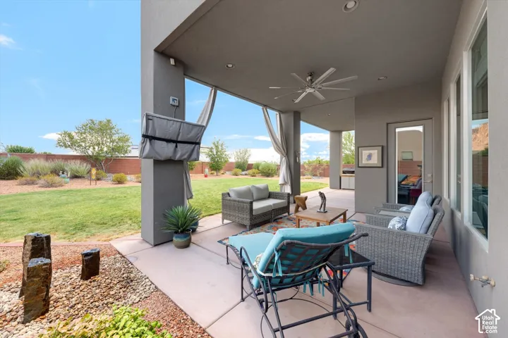Expansive covered patio with recessed lighting and a ceiling fan