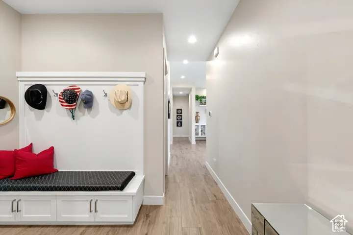 Built-in hall tree with storage bench, integrated hooks, and overhead trim detail