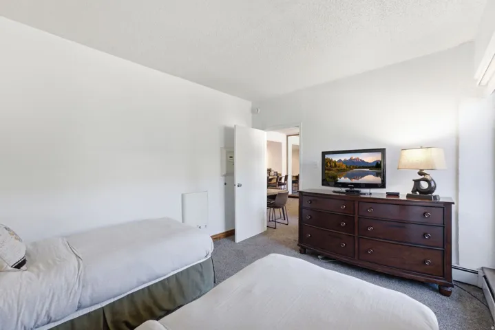 Carpeted room with white walls